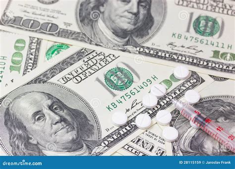 Syringe And Pills Us Dollars In The Background Stock Image Image Of