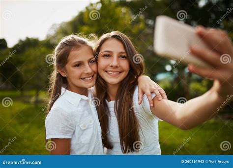 Selfie Sisters Two Young Sisters Taking Selfies In The Park Stock