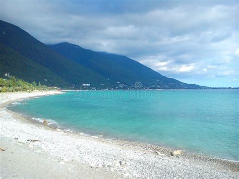 Gagra Beach on the Black Sea on the Background of Beautiful Green ...