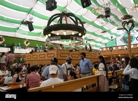 Munich, Germany - October 1, 2023. People relaxing inside the beer tent ...