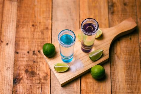 Premium Photo Tequila Shots With Salt And Lime On A Bar Table