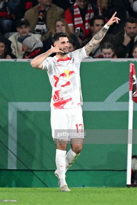 Dominik Szoboszlai of RB Leipzig celebrates scoring his side's third ...