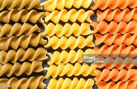 Tricolor Fusilli Dry Pasta In Italian Flag Pattern Top View Background