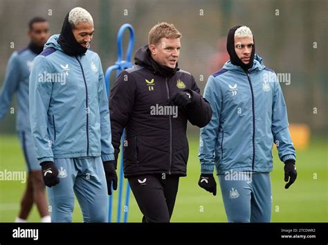 Newcastle United Manager Eddie Howe With Bruno Guimaraes Right And Joelinton Left During A