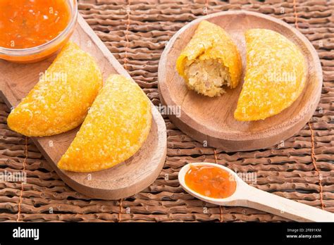 Colombian Empanada With Spicy Sauce Stock Photo Alamy