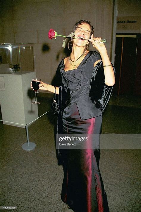 Artist Tracey Emin Poses With A Rose In Her Mouth At The Turner Prize