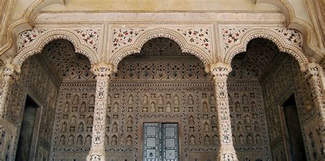 An Intricately Decorated Building With Pillars And Arches