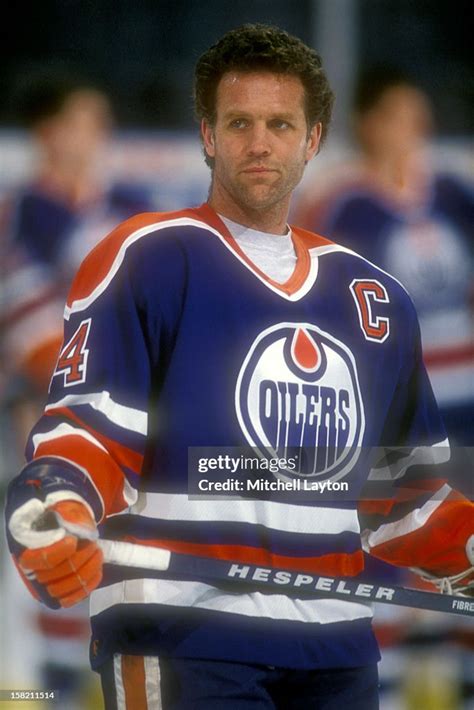 Craig MacTavish of the Edmonton Oilers looks on before a hockey game ...