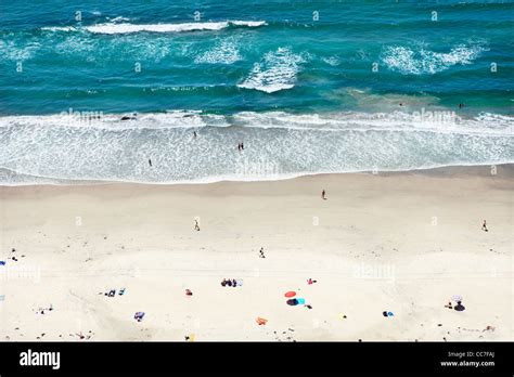 People relaxing on sunny beach Stock Photo - Alamy