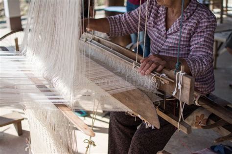 Woman Weaving Silk in Traditional Way at Manual Loom. Stock Photo ...