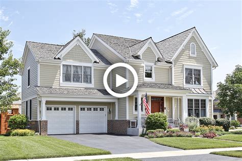 Suburban home with front porch - Reed & Associates