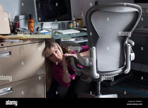 Woman Hiding Under Desk Hi Res Stock Photography And Images Alamy