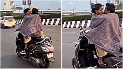 Mumbai Couple Hugs And Kisses While Riding Scooter Without Helmet On Highway Viral Video