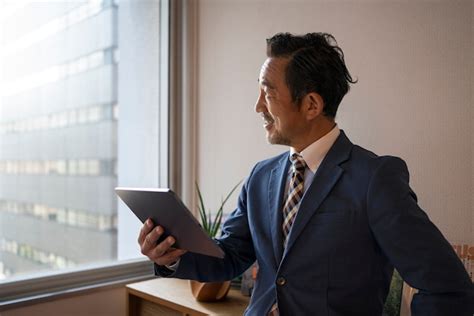 Free Photo Side View Business Man Holding Tablet