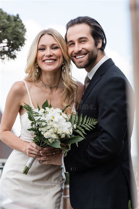 happy newlyweds  bouquet smiling  stock image image