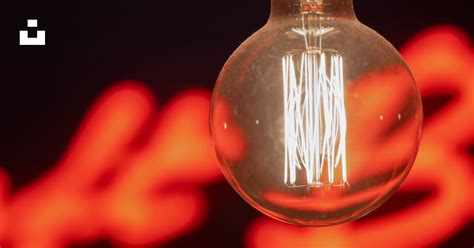 Light bulb with red light photo – Free Light Image on Unsplash