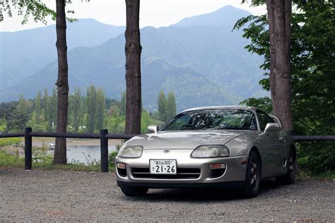 Download 4k Toyota Supra In Nature Park Wallpaper | Wallpapers.com