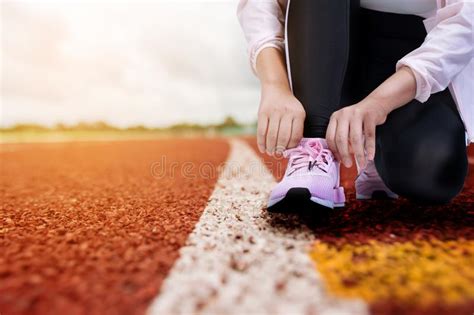 Woman Tying Laces On Running Track Stock Image Image Of Area Path