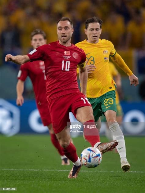 Christian Eriksen Of Denmark And Craig Goodwin Of Australia In Action