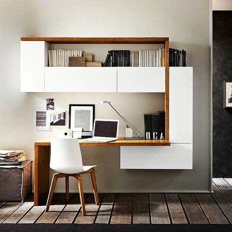 A White Desk And Chair In Front Of A Book Shelf With Books On Top Of It