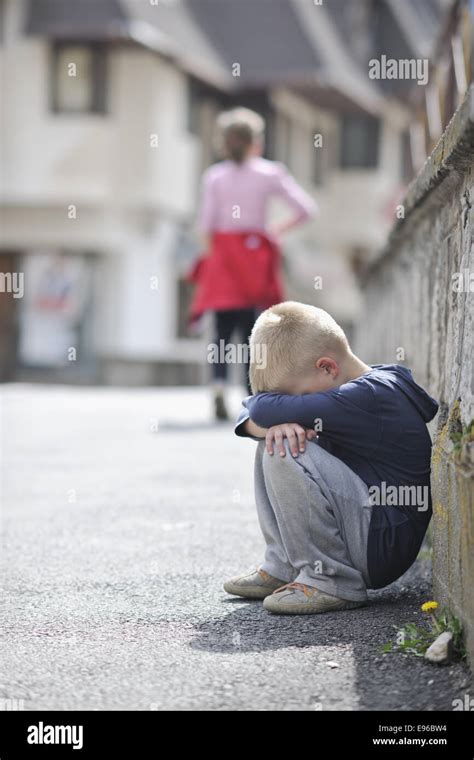 sad lonely boy on street Stock Photo - Alamy