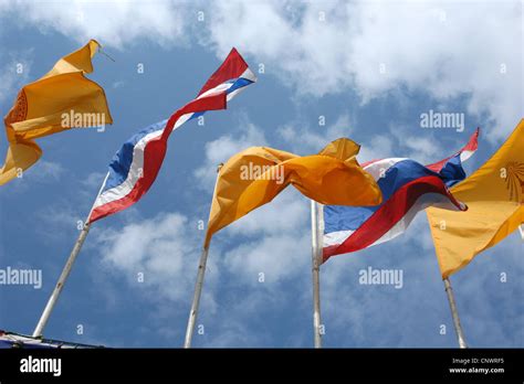 Thai National Flags And Buddhist Flags In Front Of Wat Na Phra Mane In