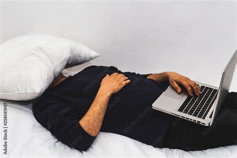 Man Sleeping While Working Laptop In Bed Tired Guy Falling Asleep