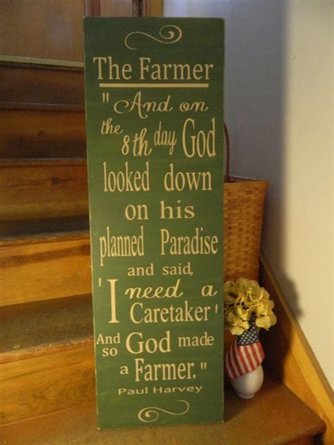 A Wooden Sign That Says The Farmer Is The Third Day God Looked Down On