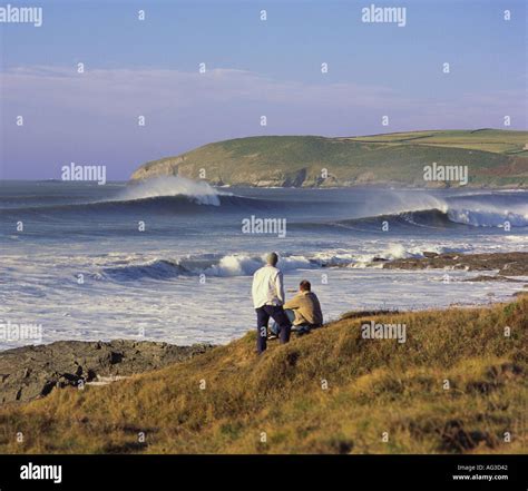 Spectacular classic surfing waves breaking at Croyde Bay with two men Stock Photo: 1064257 - Alamy