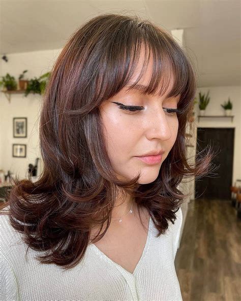 Medium Length Wavy Haircuts With Bangs