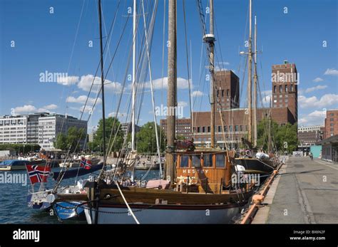 Tall Ships Anchored In Oslo Harbour The Town Hall In The Background