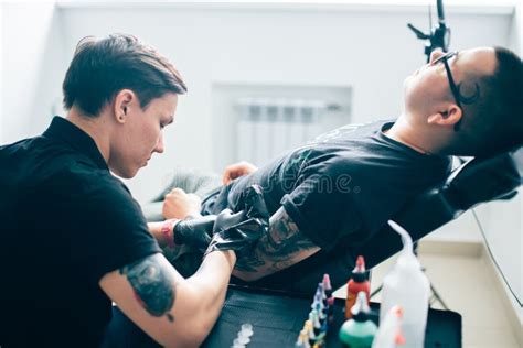 Master Makes Tattoo In Tattoo Studio Stock Photo Image Of