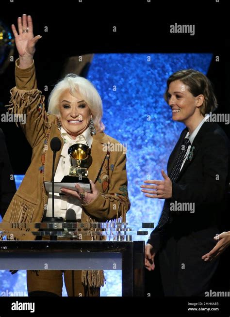 Tanya Tucker Left Accepts The Award For Best Country Album For While