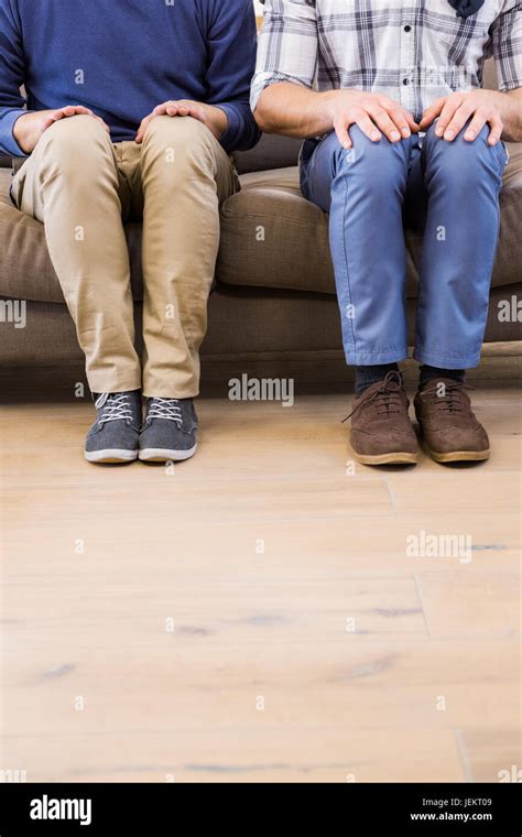 Gay Couple Relaxing On The Couch Stock Photo Alamy