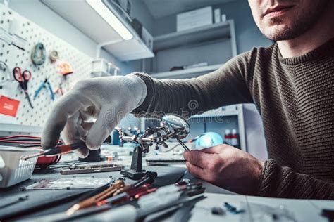 Electronic Technician Working In The Repair Shop Stock Image Image Of