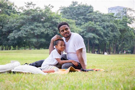 Cheerful African American Father And Son Playing In Park Happiness