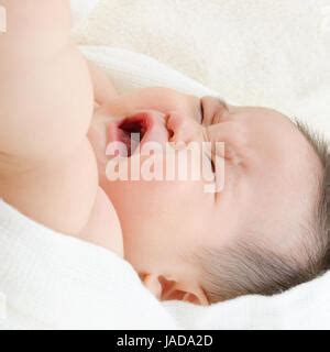 Hungry Asian Baby Boy Crying Lying On Bed Stock Photo Alamy