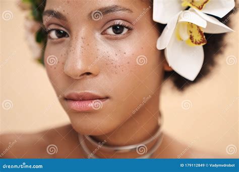 Portrait Of Half Naked African American Woman With Flowers In Her Hair