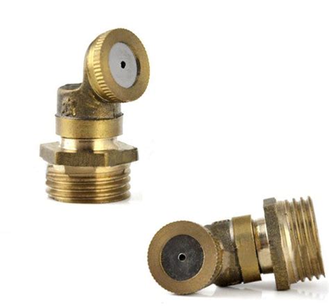 two brass fittings on a white background