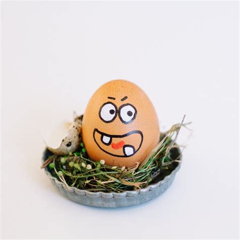 Depiction Of An Angry Face On An Egg In A Cute Small Plate On A White