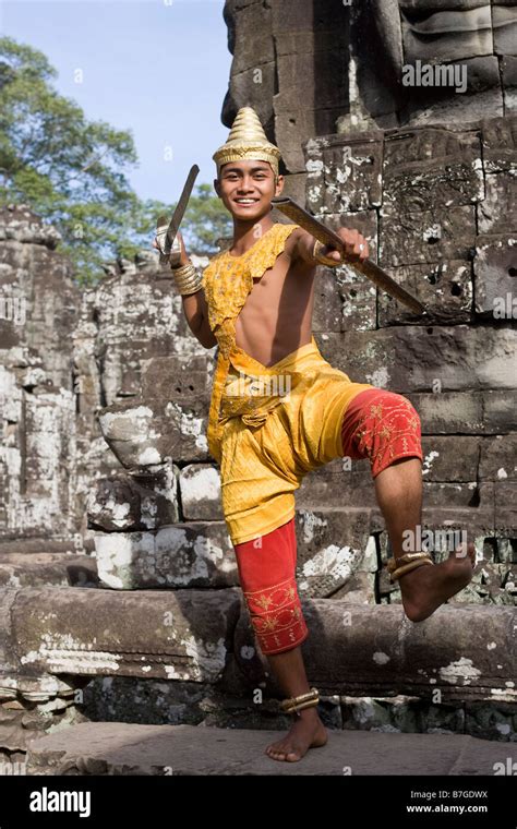 Man In Traditional Dress Bayon Temple Angkor Cambodia Stock Photo Alamy