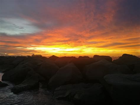 Hiding behind the rocks (Trinidad and Tobago) : r/sunset