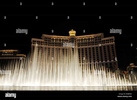 Exterior view of bellagio hotel at night with fountains hi-res stock ...