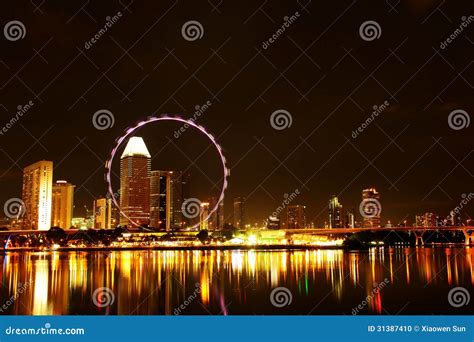 Singapore Flyer Skyline At Night Stock Photo - Image: 31387410