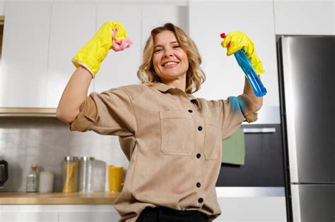 Premium Photo Housekeeper Feels Powerful Woman With Cleaning Agent