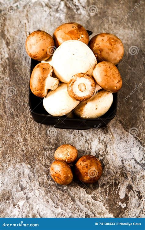 Fresh Whole White Mushrooms Or Agaricus In A Bowl On A Rustic Stock