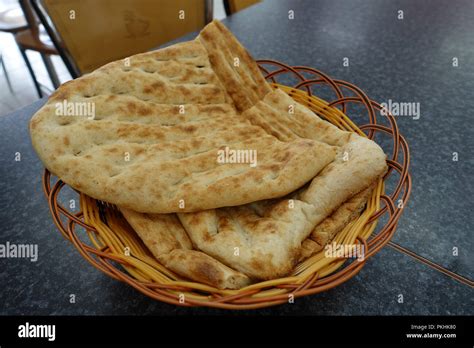 Afghan Naan bread in wooden basket Stock Photo - Alamy