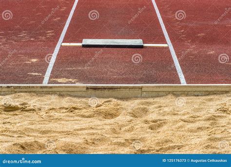 Long Jump Pit in a Stadium stock image. Image of participate - 125176373