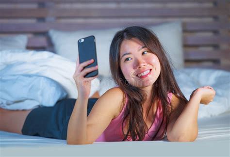 Young Beautiful And Happy Asian Chinese Woman On Her 20s Taking Selfie