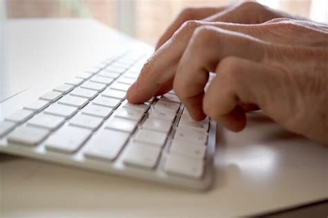 Premium Photo Close Up Of Person Typing On Keyboard